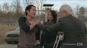 A- Hershel greets Glenn and Maggie as they arrive back at the prison