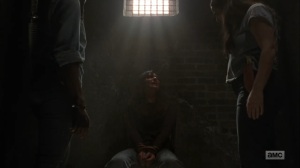 Adaptation- Michonne, Tara, and Daryl interrogate the prisoner- AMC, The Walking Dead